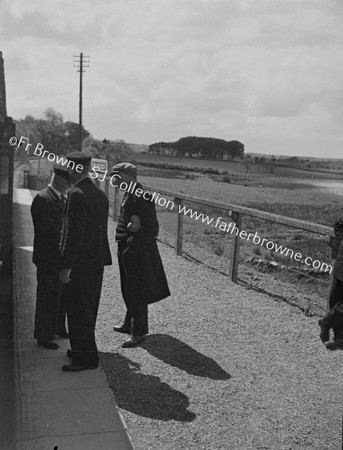 RAILWAYMEN IN CONVERSATION ON PLATFORM